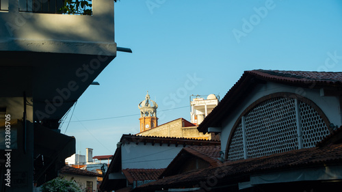 Great Clock Tower in The Sun in The Distance In Puerto Vallarta Mexico photo