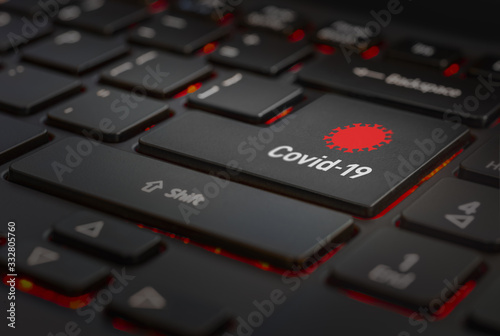 computer keyboard with covid 19 symbol on the enter key photo