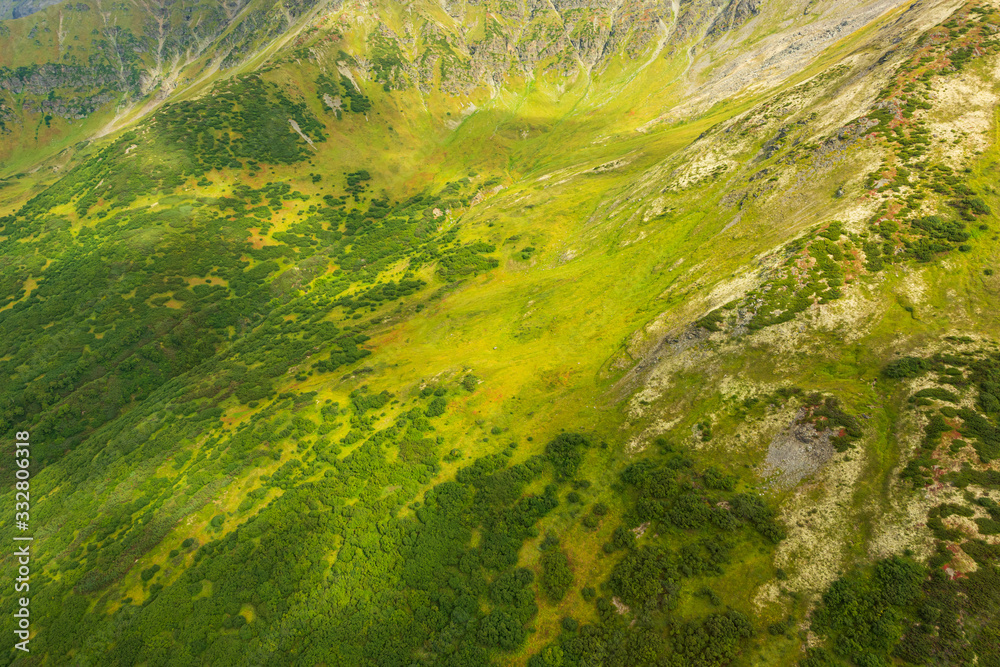 aerial view of Kamchatka volcanos, green valleys, snow and ice and the wonderful view of pure nature. aerial view of Kamchatka volcanos, green valleys, snow and ice and the wonderful view of pure nature.