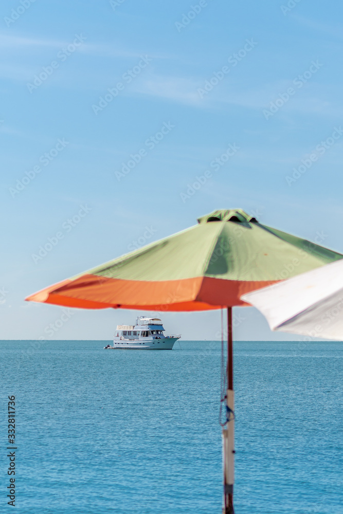 Yatch and Beach Umbrella on a sunny day