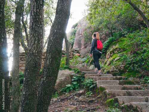 young girl climbing stairs outdoors at nature photo