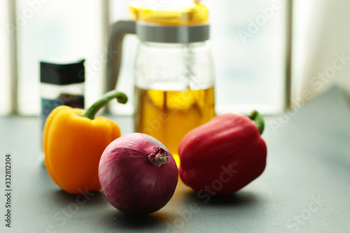 Peppes and oil can on the table