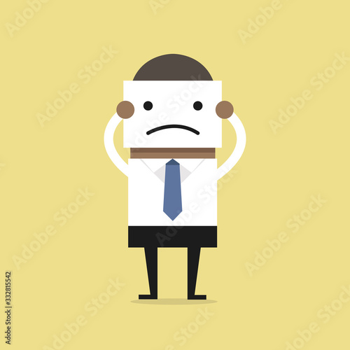 African businessman hide his real face by holding bad mood mask.