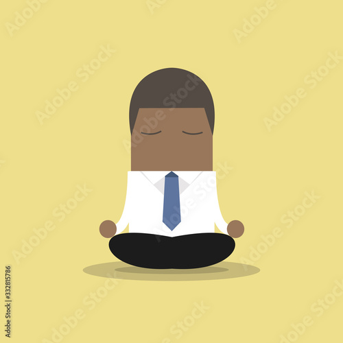African businessman yoga relaxing during hard workday.