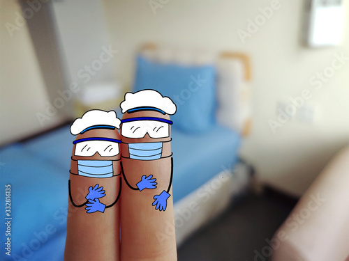 Two fingers are decorated as two person. They are wearing goggles and gloves. They are medical personnel. 