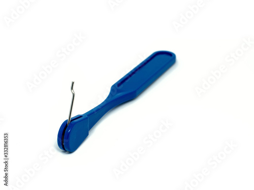 Key on plastic grip use for setting children teeth braces. photo
