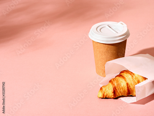 Cup of coffee and croissant.