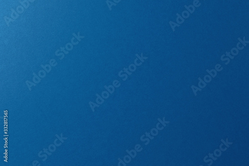 Blue paper background, copy space, horizontal.