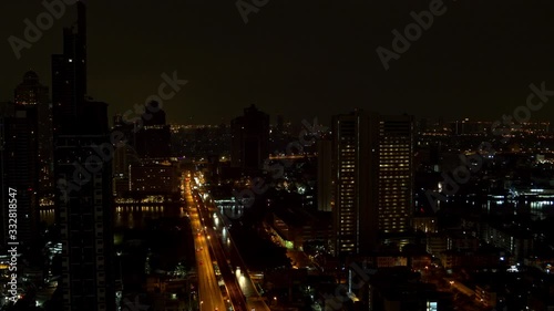Wallpaper Mural 4K High angle aerial view of futuristic skyscraper and traffic on the road with illuminated night lights at downtown district. Metropolis with business financial building and city street at night. Torontodigital.ca