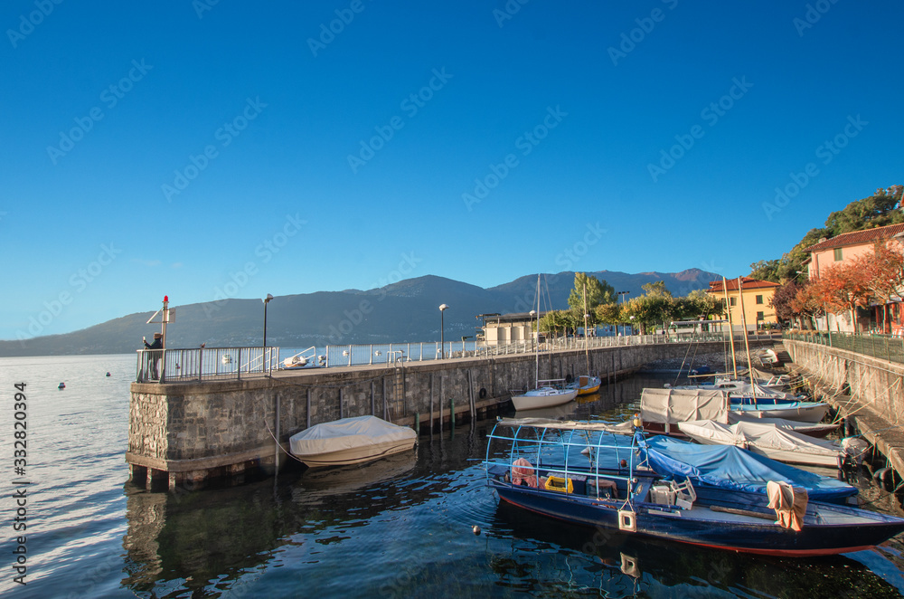 Castelveccana,characteristic little port of lake maggiore in a light summer day. Italy