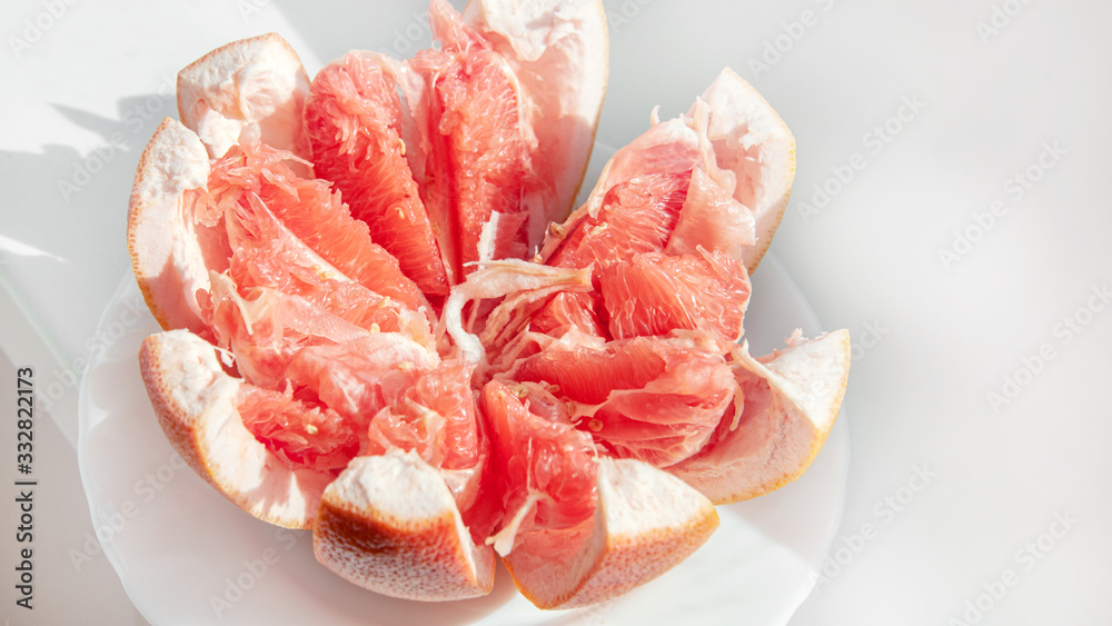 Red juicy ripe Israeli grapefruit in the cut. Fruit background. Copy of the space. Close up