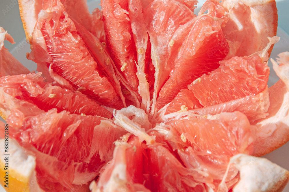 Red juicy ripe Israeli grapefruit in the cut. Fruit background. Copy of the space. Close up Red juicy ripe Israeli grapefruit in the cut. Fruit background. Copy of the space. Close up