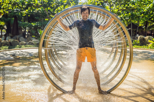 Man in Water tunnel in the water amusement park photo