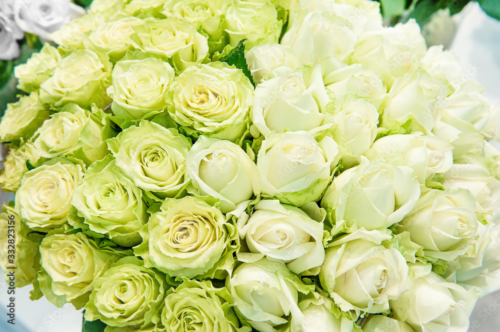 Romantic bouquet of beautiful delicate yellow and white roses. Close-up Romantic bouquet of beautiful delicate yellow and white roses. Close-up