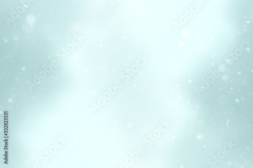 blurred snow / winter abstract background, snowflakes on abstract blurred glowing leaf background © kichigin19