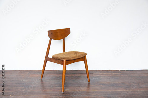 Vintage wooden chair on on wooden parquet floor.
