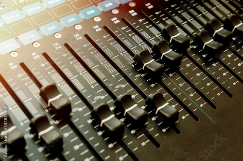 Detail with adjusting knobs on a professional audio mixer and music equipment for sound mixer control, electronic device