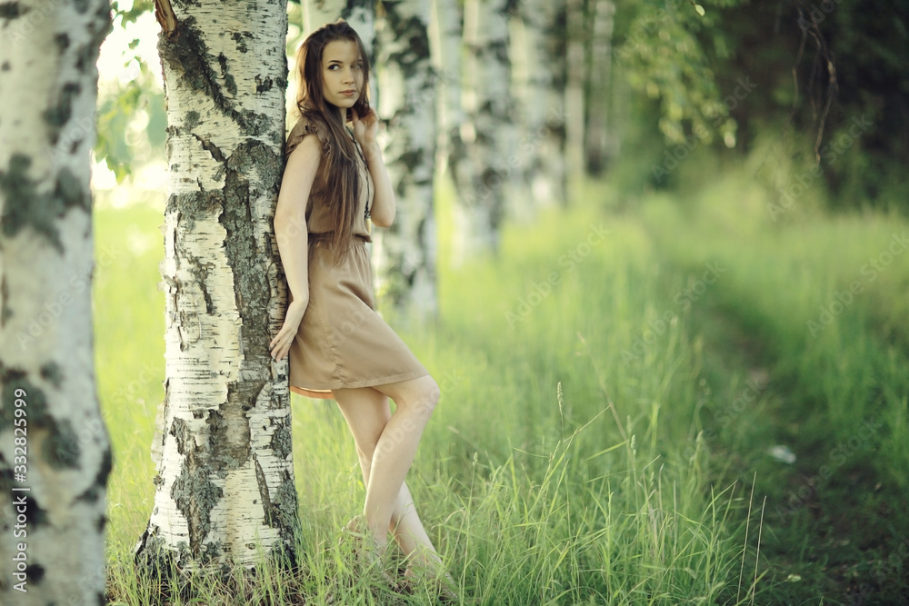 Summer sunny park portrait of a beautiful young woman Summer sunny park portrait of a beautiful young woman