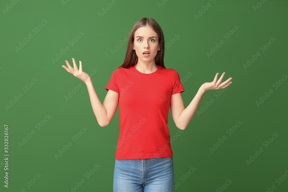 Helpless young woman on color background. Concept of choice Helpless young woman on color background. Concept of choice