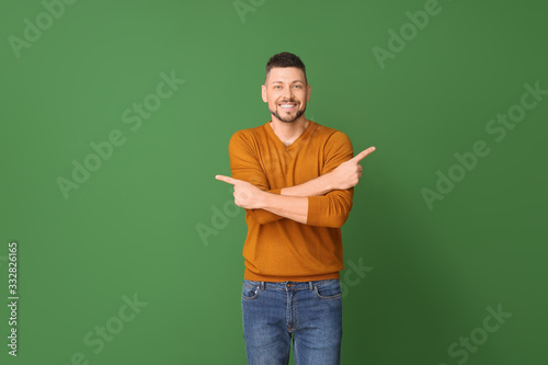 Man pointing in different d...