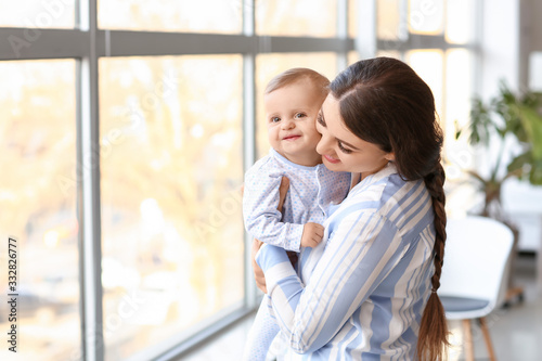Happy mother with cute litt...