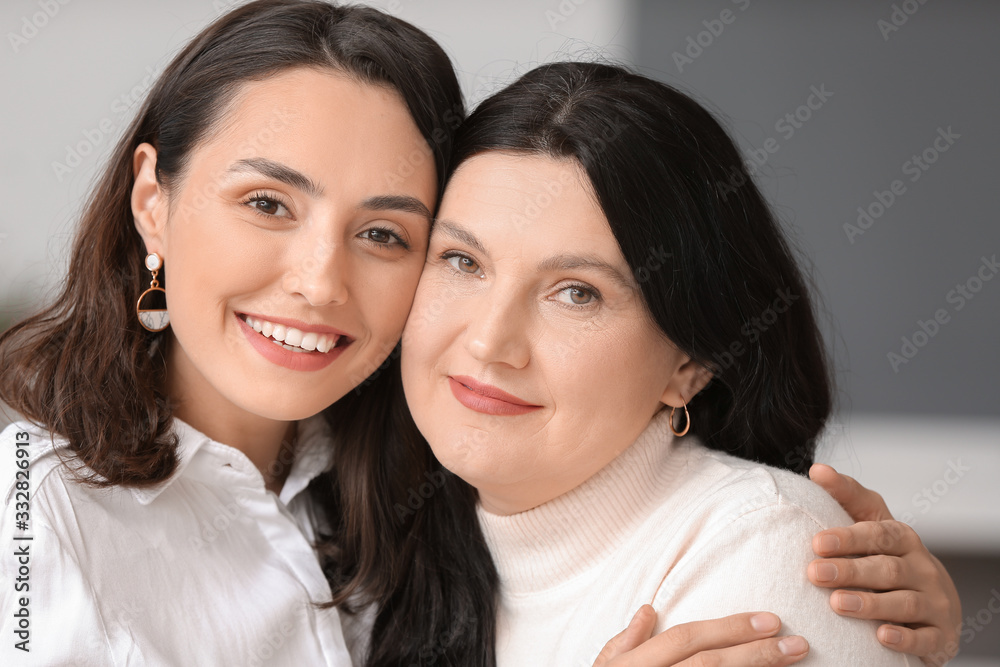 Adult daughter with her mother spending time together at home Adult daughter with her mother spending time together at home