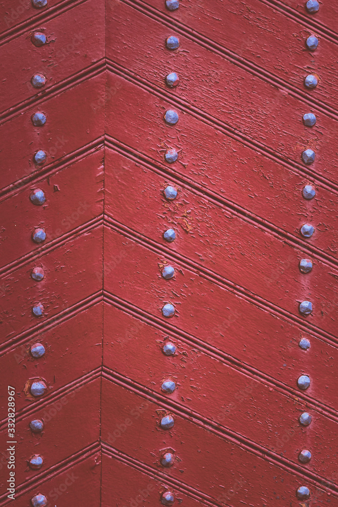 Old wooden background with metal rivets