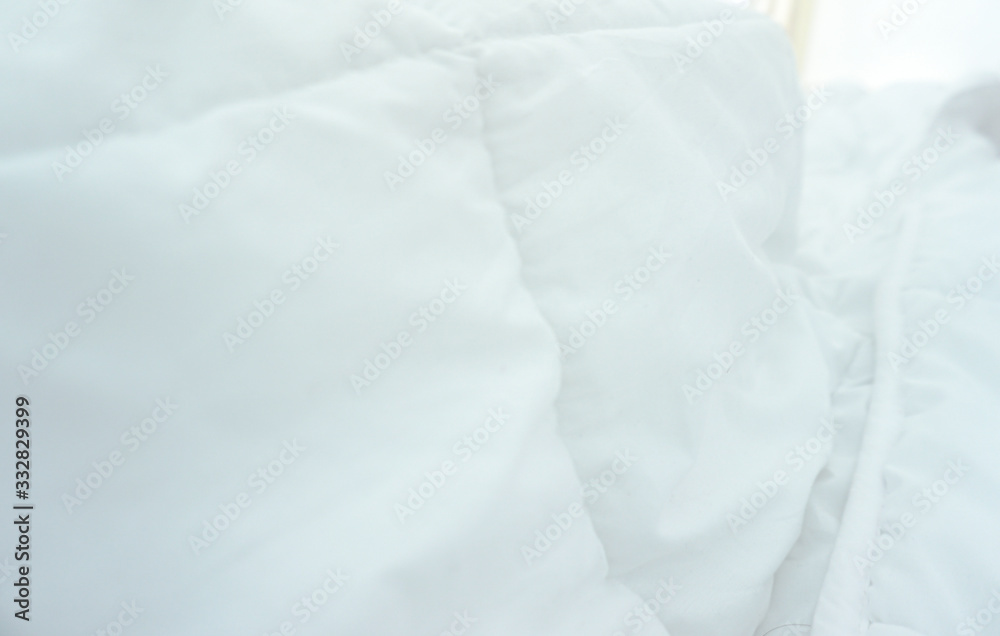 White blanket in hotel bedding sheet with softer wave use for background wallpaper White blanket in hotel bedding sheet with softer wave use for background wallpaper
