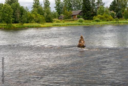 Threshold Staircase to the Msta river on a summer rainy day. Borovichi district, Novgorod region, Russia photo