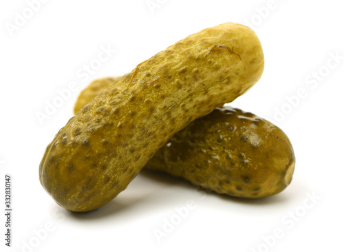 Marinated pickled cucumbers on white background