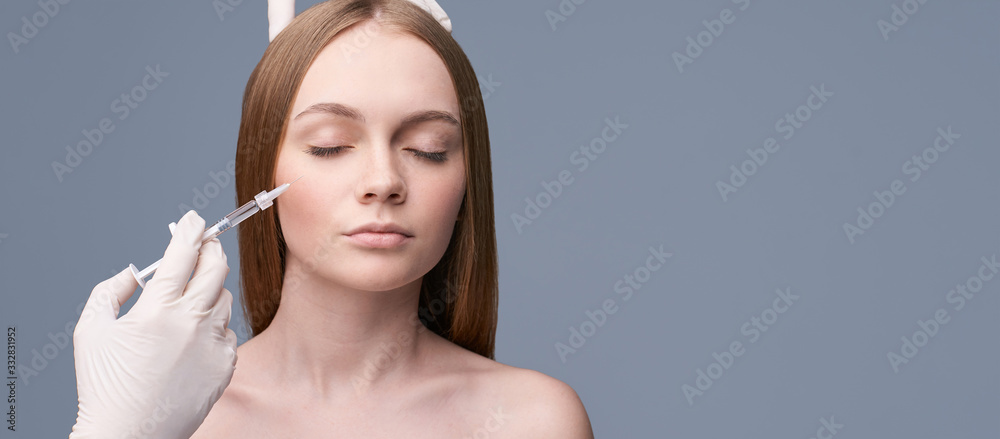 Young pretty woman studio portrait. Cosmetology biorevitalization concept. Esthetic woman injection face. Skin care dermatolog rejuvenation. Harmony girl treatment. Filler collagen therapy. horizontal