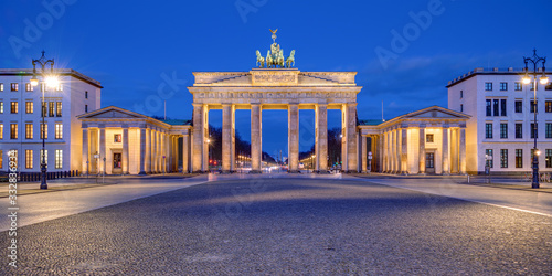 Panorama of the illuminated Brandenburg Gate in Berlin at dawn