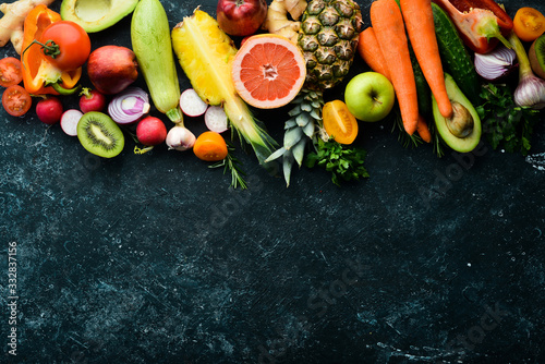 Organic food: Fresh vegetables and fruits on a dark background. photo