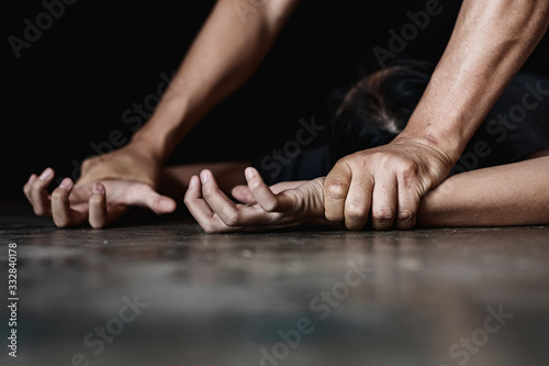 Image for rape and sexual abuse concept.Sexual abuse is a problem or Social issues concept. male hand holding a woman hand for rape and sexual abuse. photo