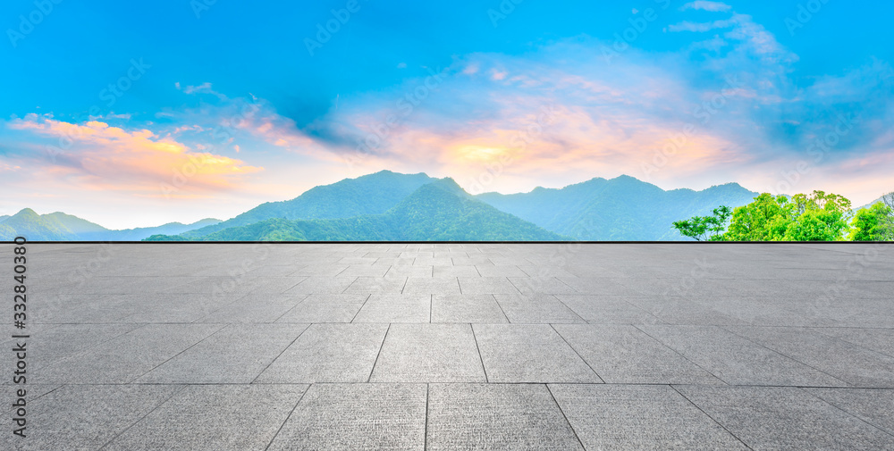 Obraz premium Empty square floor and green mountain nature landscape at sunset,panoramic view.