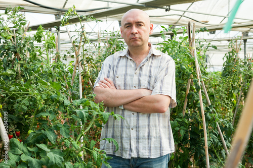 Male farmer in greenhouse