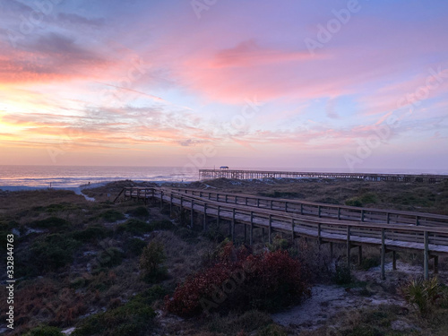 sunset over the ocean boardwalk pier