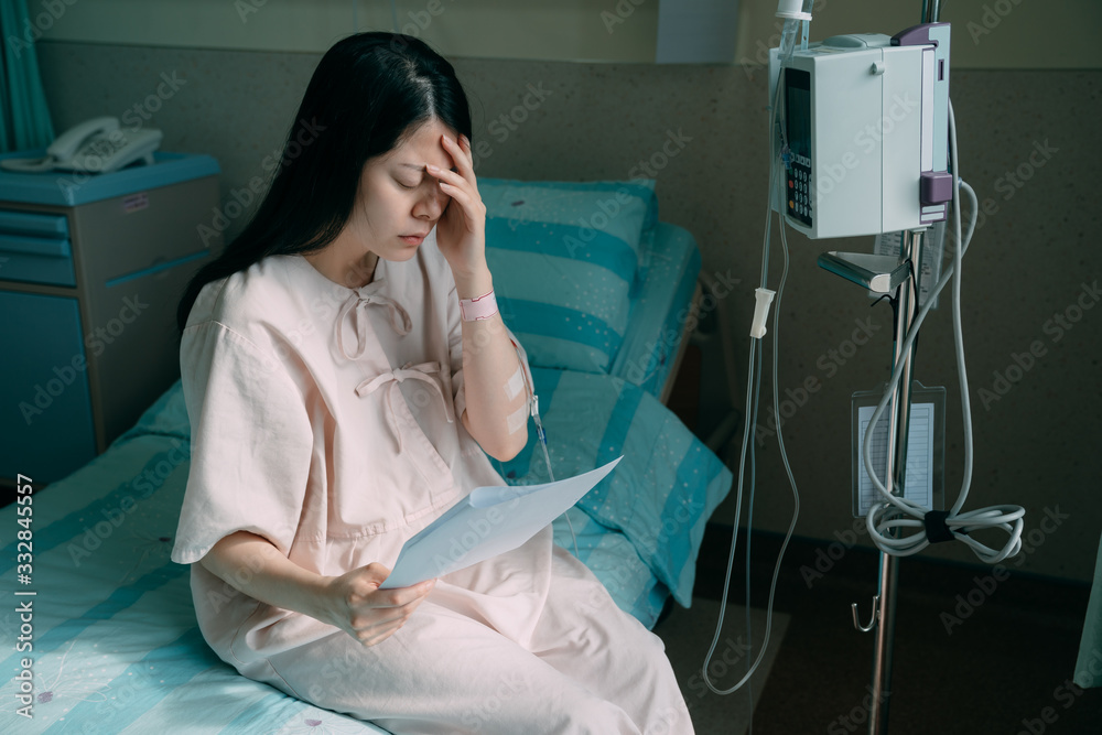 sad woman read bad news about pulmonary x-ray result in hospital ...