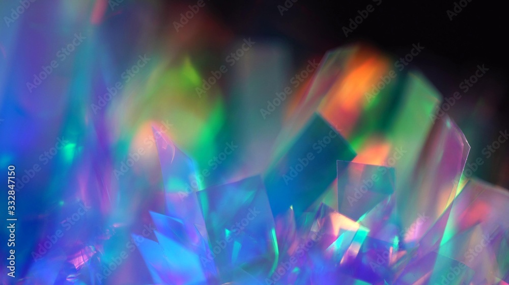 Holographic iridescent tinsel. Hologram Background of abstract shiny foil texture with rainbow colors. Neon pastel gradient of real surface Holographic iridescent tinsel. Hologram Background of abstract shiny foil texture with rainbow colors. Neon pastel gradient of real surface