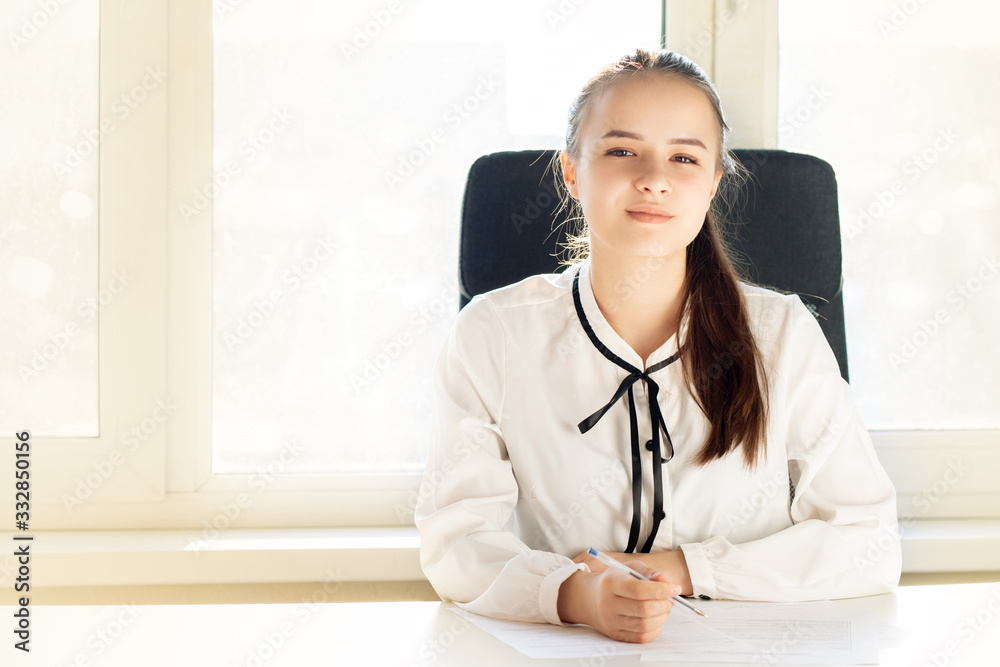 Drafting a contract. Female partner signs documents at office Drafting a contract. Female partner signs documents at office