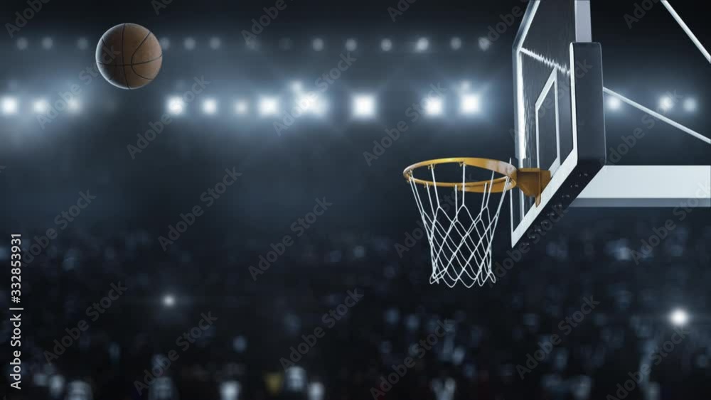 Basketball hit the basket in slow motion on the background of flashes of cameras