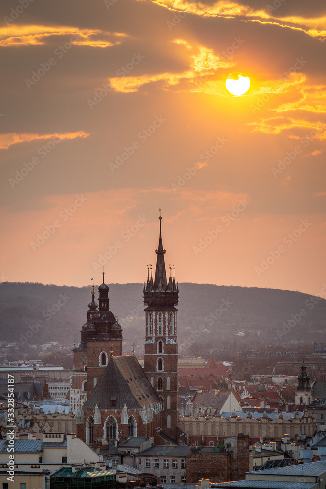 Naklejka premium View to Cracow - St Mary's Church, Market during sunset