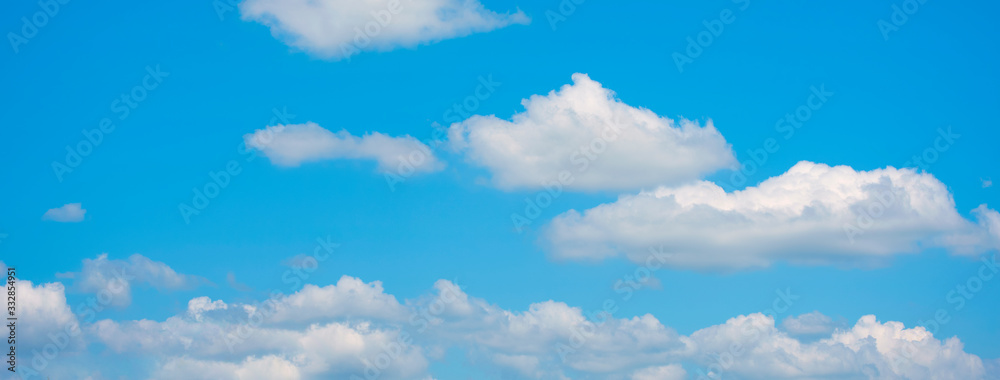 Panorama blue sky fluffy white cloud summertime on light sunny day cloudscape. Clear bright blue skyline sunlight climate panoramic background. Heaven blue environment ecology scenic nature background