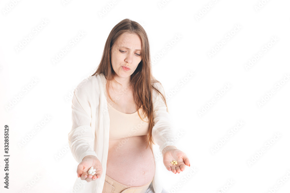 Pregnant woman holding medicine