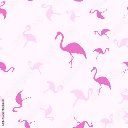 Flamingos isolated on a pink background. Exotic bird.