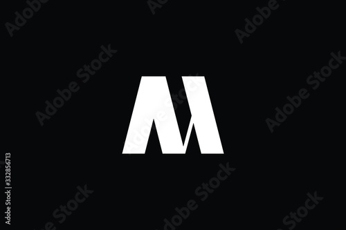 Minimal elegant monogram art logo. Outstanding professional trendy awesome artistic M MN NM initial based Alphabet icon logo. Premium Business logo White color on black background