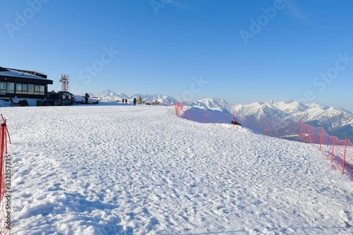 vacationers on the background of peaks in a ski resort