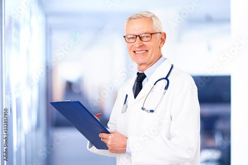 Senior male doctor portrait while standing in the hospital