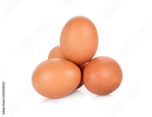 four chicken eggs isolated on white background