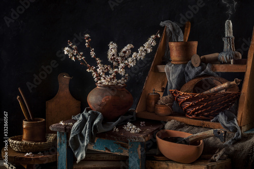 Branches of apricots in bloom on an old vintage wooden background. country style. Still life. Spring. Flowering fruit trees.